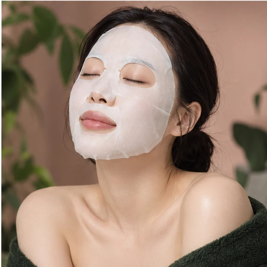 Korean beauty model wearing a facial sheet mask